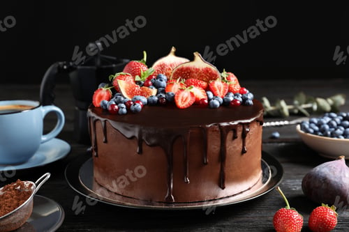 Preview: Fresh delicious homemade chocolate cake with berries on table against dark background
