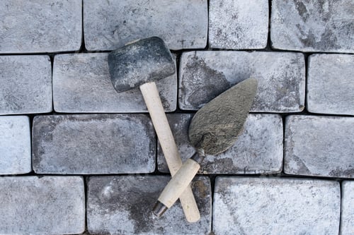 Preview: tools for Laying paving stones Laying a garden path made of tiles. mallet, spatula