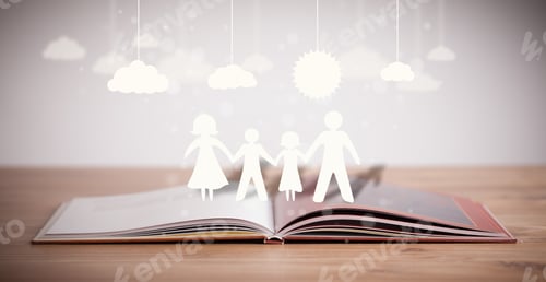 Preview: Cardboard Figures Of The Family On Opened Book. The Symbol Of Unity And Happiness