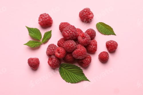 Preview: Tasty fresh ripe raspberries and leaves on pink background, flat lay