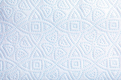 Preview: Toilet paper with pattern as background, closeup