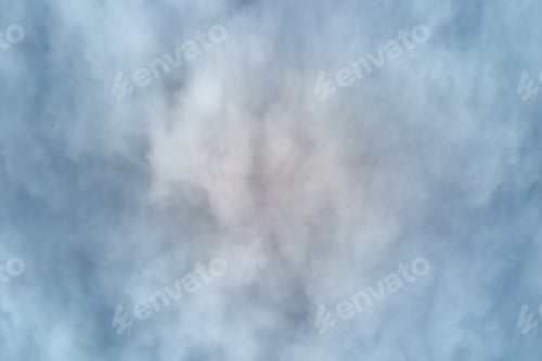Preview: Aerial view from high altitude of earth covered with puffy rainy clouds forming before rainstorm