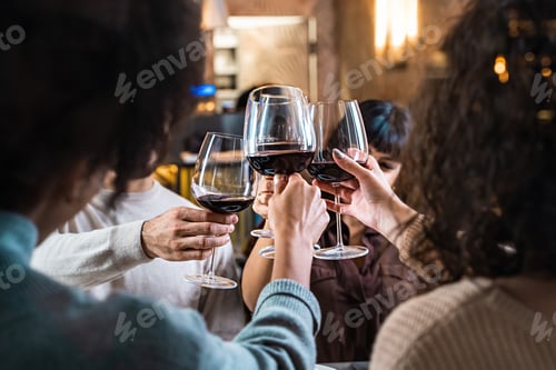 Preview: Multicultural Friends Toasting in Elegant Restaurant