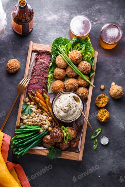 Preview: Arabian style dinner: falafel, beef, babaghanoush, bean, green peas and roots vegs. Top view.
