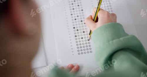 Preview: Above, exam and person at desk for education, paper and multiple choice assessment at school. Stude