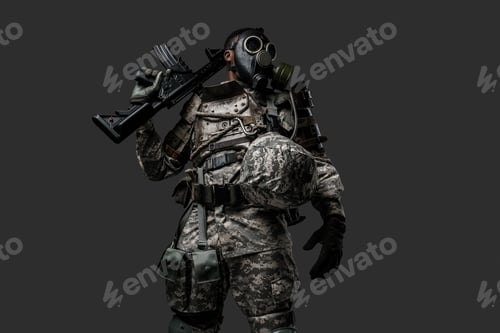 Preview: Armed soldier of african descent with gas mask and rifle