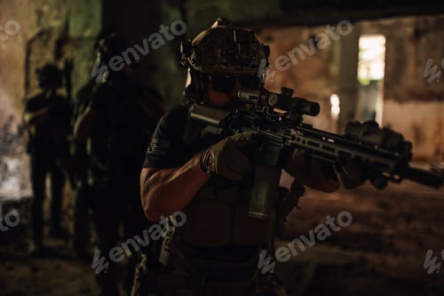 Preview: Brave soldier in dark ruins sneaking with rifle in his hands.