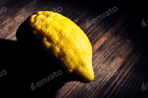 Preview: lemon on a dark wood rustic table