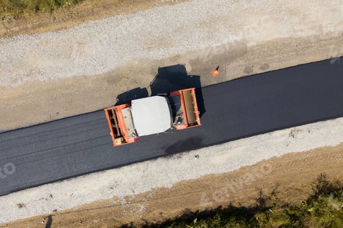 Preview: Aerial view of new road construction with steam roller machine at work