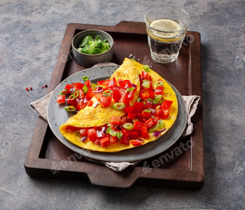 Preview: omelette with tomato, bell pepper onion chili and cheese. healthy breakfast