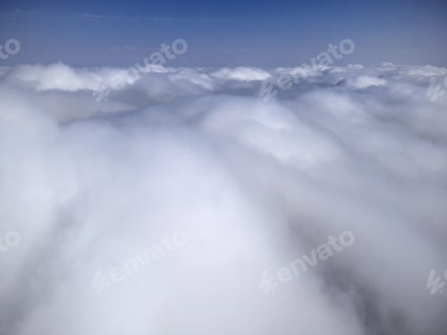 Preview: Above the clouds on a sunny day, view from a drone