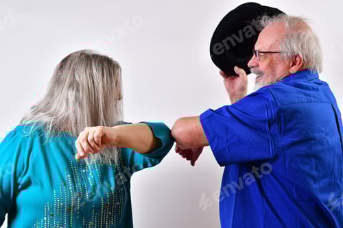 Preview: Couple doing elbow bump to greet each other - concept of the new normal