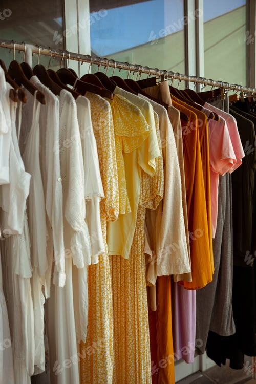 Preview: Many clothes hanging at retail store. Shopping concept