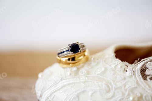 Preview: Closeup shot of wedding rings on the surface - wedding concept