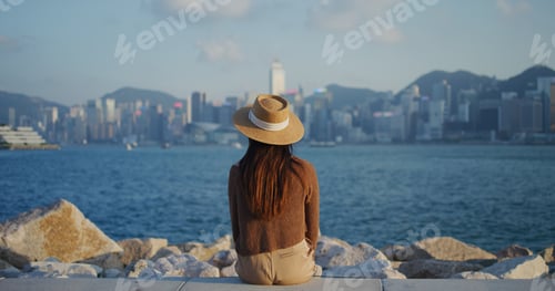 Preview: Woman look at the city of Hong Kong