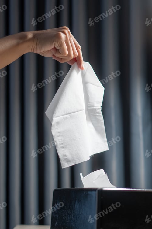 Preview: Woman hands taking paper tissue out of box