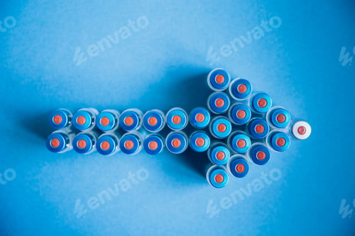 Preview: Vaccine bottles on a blue background forming an arrow.