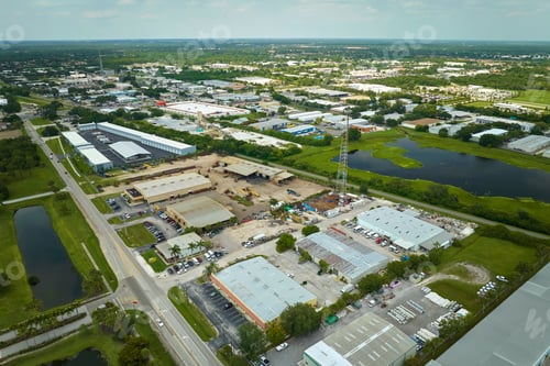 Preview: Aerial view of industrial park with goods warehouses and logistics centers in city zone from above