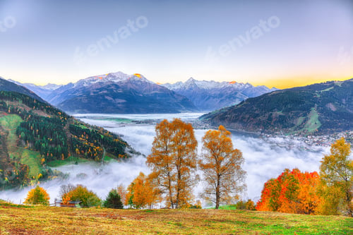 Preview: Spectacular autumn view of lake meadows trees and mountains in Sell Am See