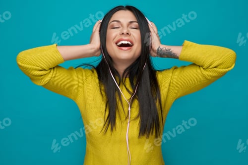 Preview: Model listening music with headphones, enjoying