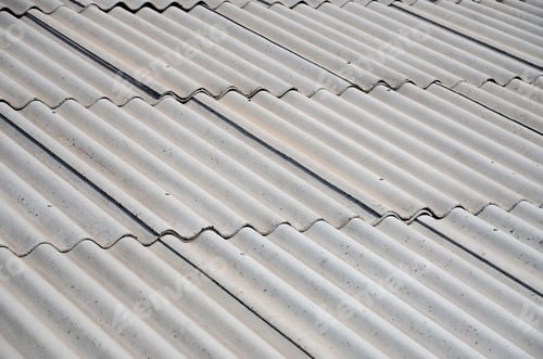 Preview: A fragment of a gray slate roof of an old sample made of asbestos material
