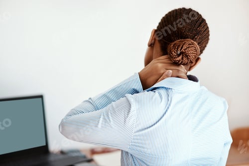 Preview: Cropped shot of a businesswoman experiencing neck pain at work