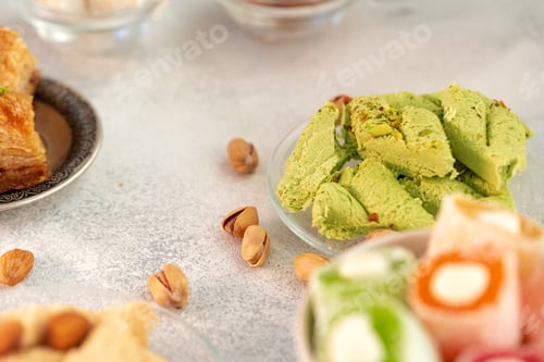 Preview: Close up of colorful Turkish halva sweets on gray surface
