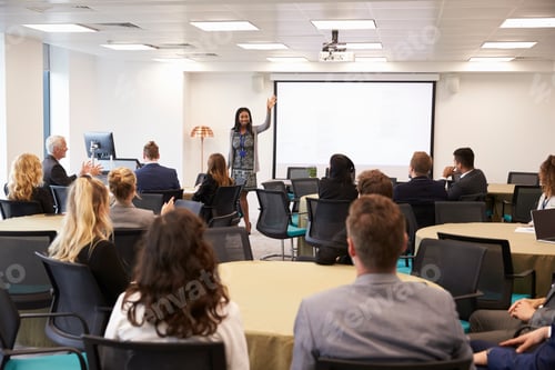 Preview: Businesswoman Making Presentation At Conference