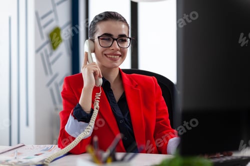 Preview: Businesswoman having a phone coversation with financial adviser