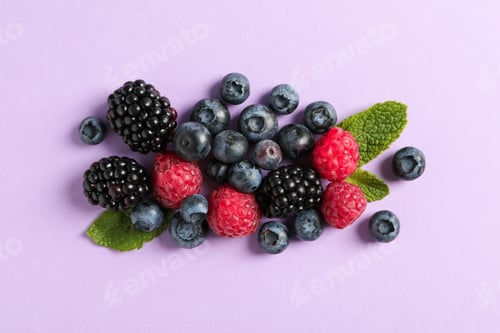 Preview: Flat lay composition with berries on color background, space for text