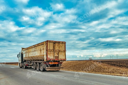 Preview: Truck on the road through countryside
