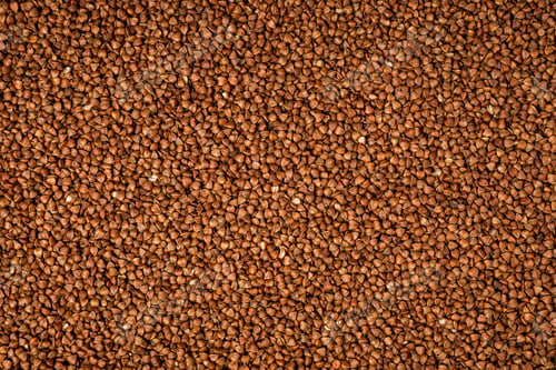 Preview: Close-up photo of buckwheat grain as a natural vegan food background and texture