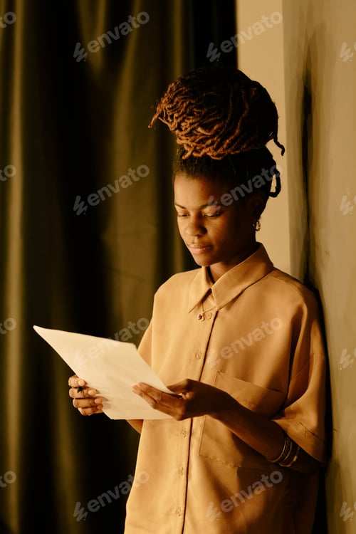 Preview: Reading Document in Warmly Lit Environment