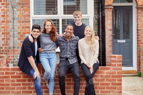 Preview: Portrait Of Group Of Smiling College Students Outside Rented Shared House