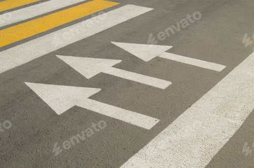 Preview: Asphalt road with arrow sign shows the direction of movement