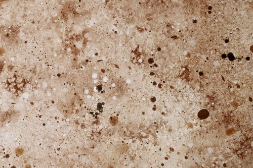 Preview: Surface with varied textures and colors, resembling natural stone or earth