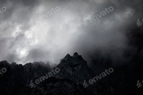 Preview: dark couds around mountain peak
