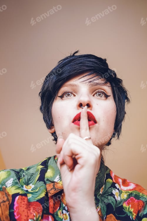 Preview: Young androgynous woman asking for silence