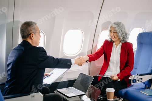 Preview: Business meeting in airplane, asian Mature businessman in private jet is talking