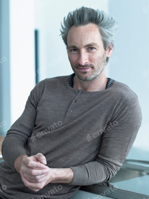 Preview: Germany, Hamburg, Portrait of a man, hands folded