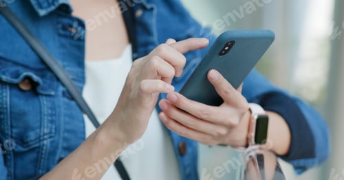 Preview: Close up of woman use of mobile phone