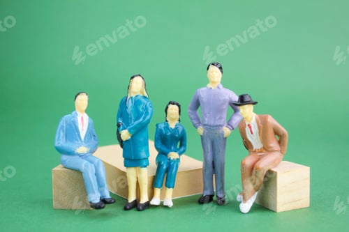 Preview: Group of Figurines Posing Together on Wooden Blocks
