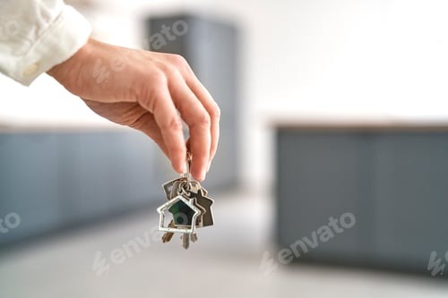 Preview: Unrecognizable hand holding a bunch of keys for new house