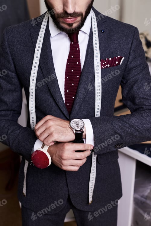 Preview: Handsome Tailor Wearing Bespoke Suit