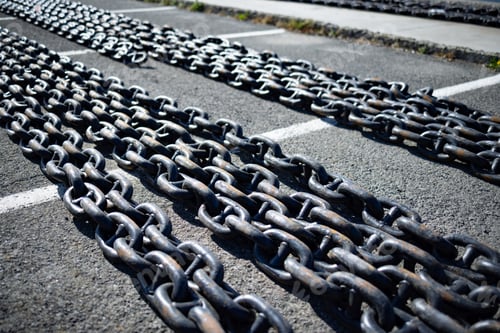 Preview: Chains for ships lies on the pier against the background of a cloudy sky and the Black Sea