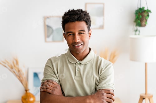 Preview: Smiling black man in casual wear