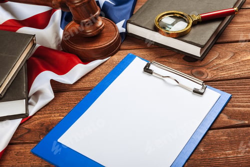 Preview: blank clip board and USA flag on wooden background