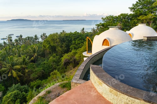 Preview: Luxury resort in jungles above seashore stock photo