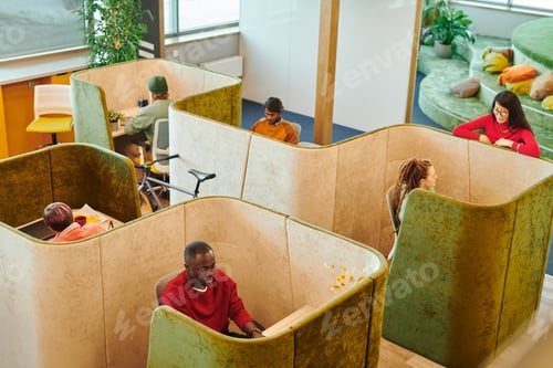 Preview: Two young intercultural designers talking to African businessman at meeting