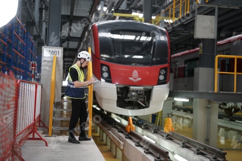 Preview: The Engineer Checks The Condition Of Electric Train at railway track. walk along side by the train.